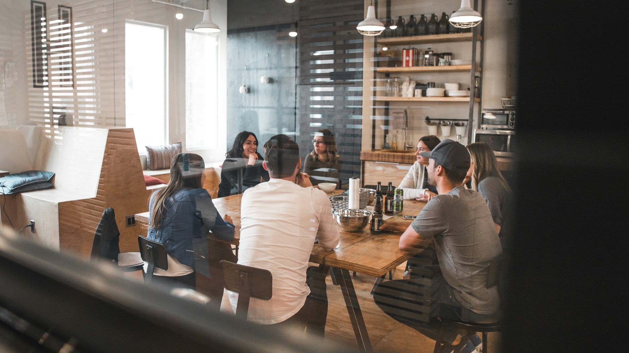 Team discussing market intelligence in a modern office